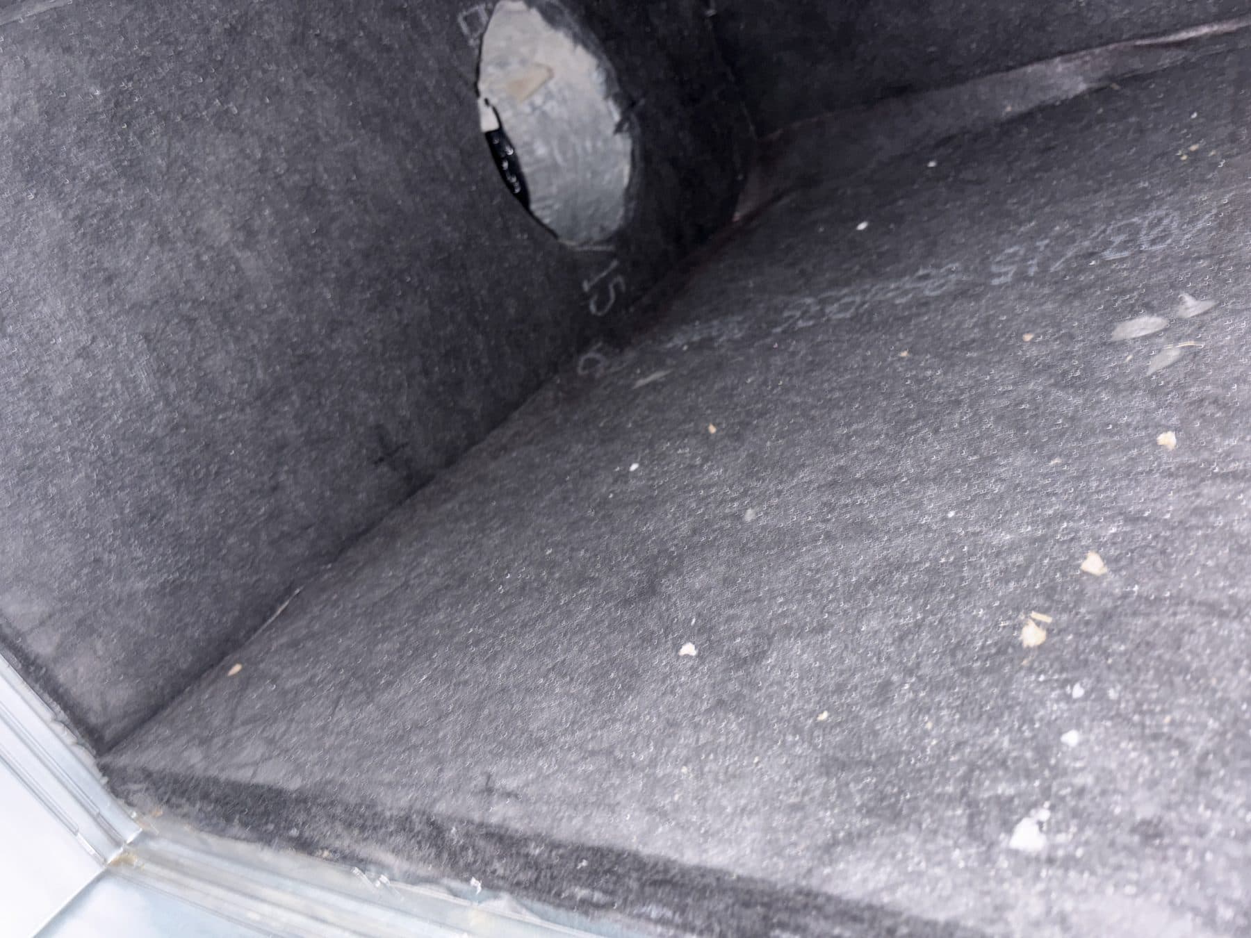 Interior of a fibreglass duct board return box after cleaning